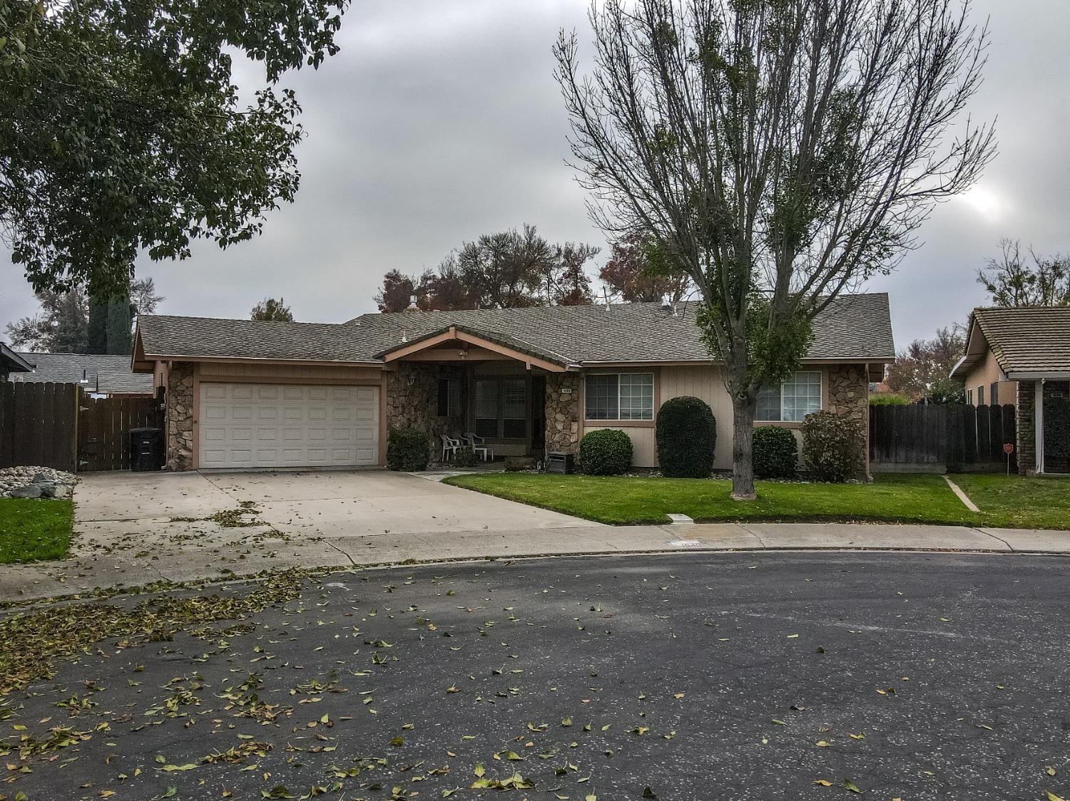 1540 Switzer Court Modesto, CA 95350 - Photo 2 of 43 a front view of a house with a yard and garage