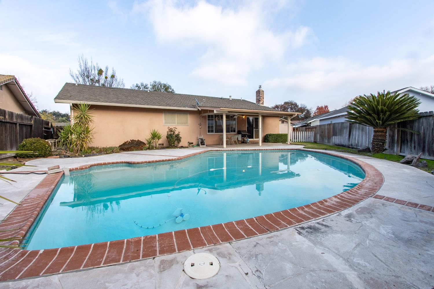 1540 Switzer Court Modesto, CA 95350 - Photo 28 of 43 a view of a house with swimming pool