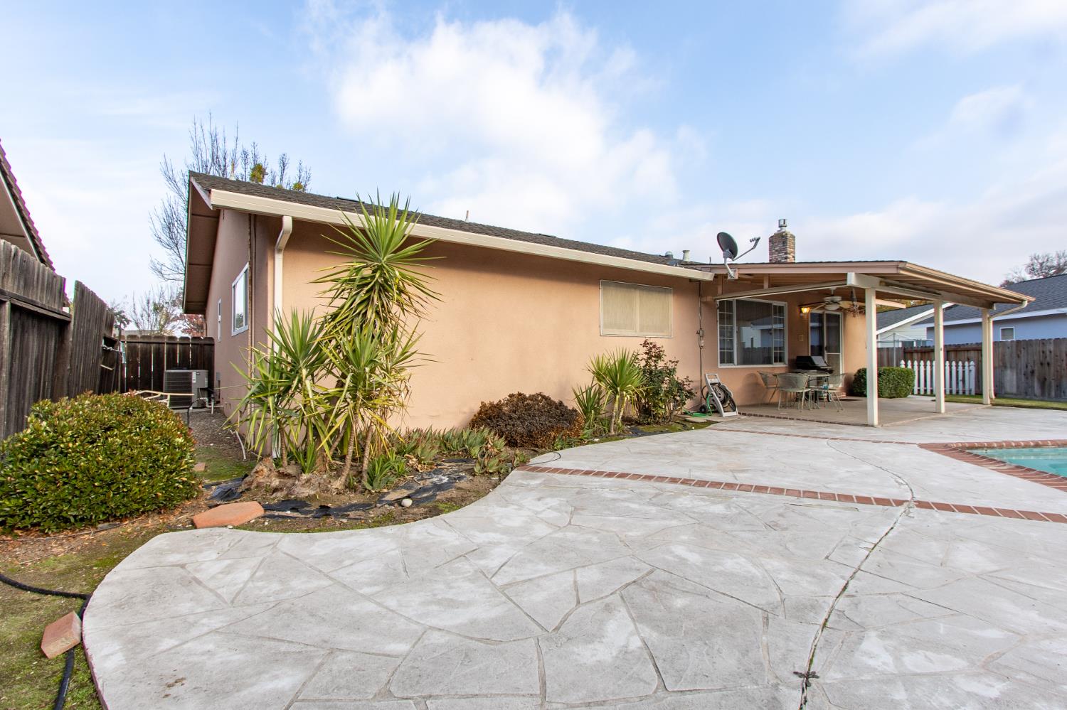1540 Switzer Court Modesto, CA 95350 - Photo 31 of 43 a view of a house with backyard and sitting area