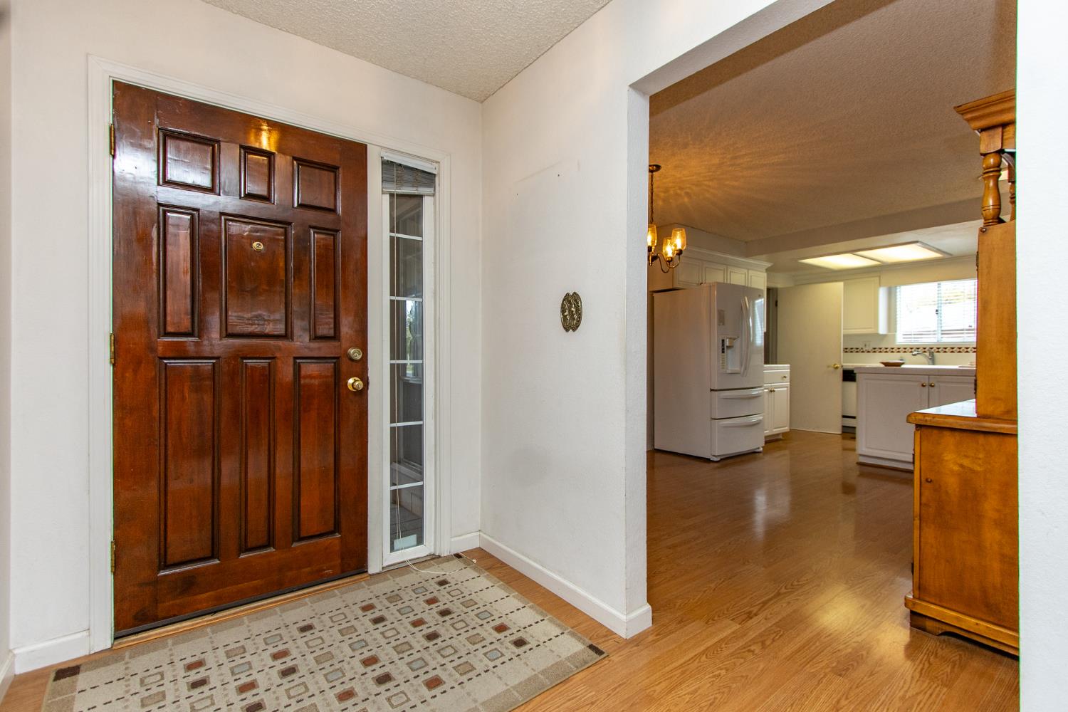 1540 Switzer Court Modesto, CA 95350 - Photo 4 of 43 a view of a hallway with closet and livingroom view