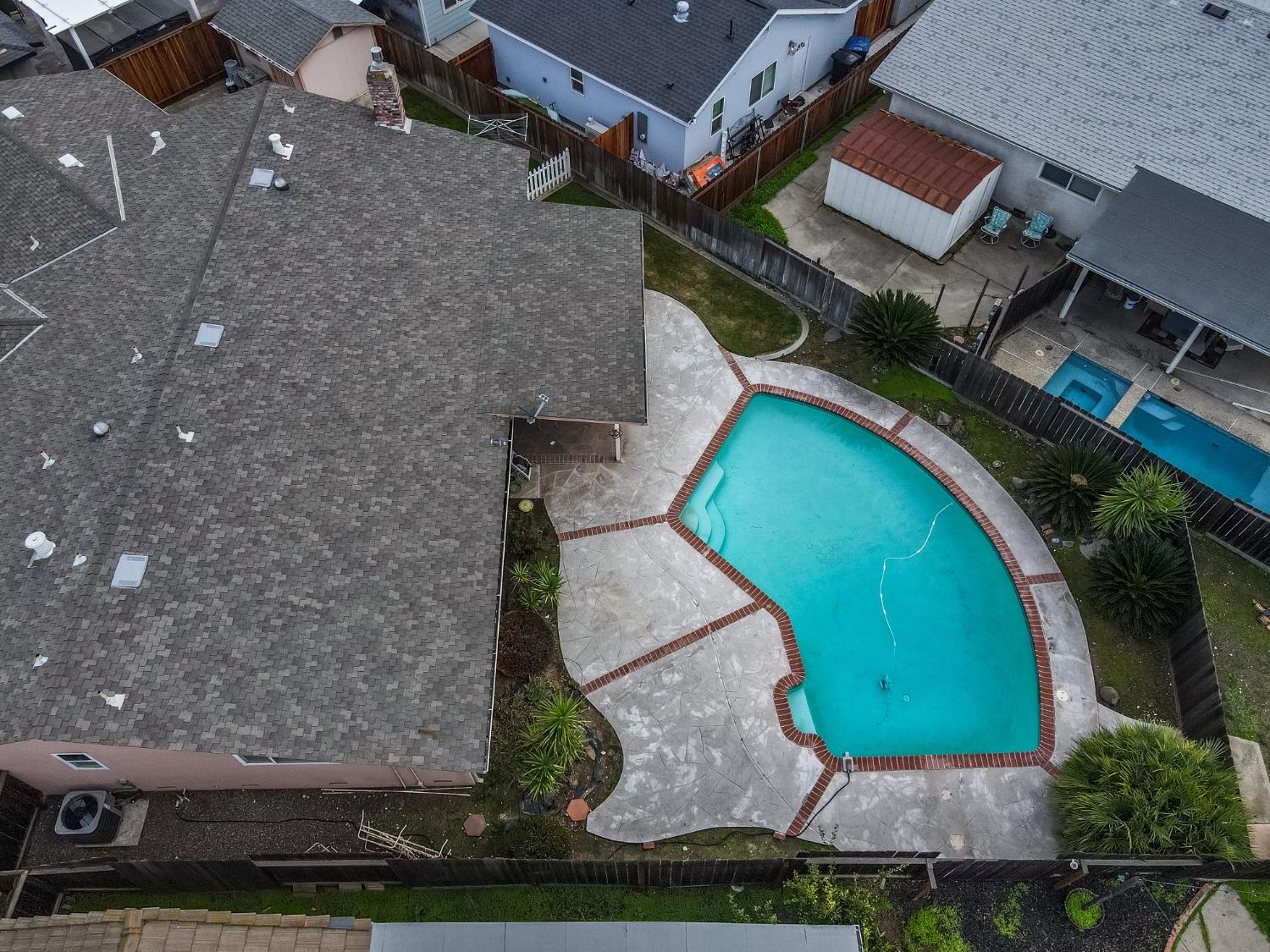 1540 Switzer Court Modesto, CA 95350 - Photo 42 of 43 an aerial view of a house with a garden and trees