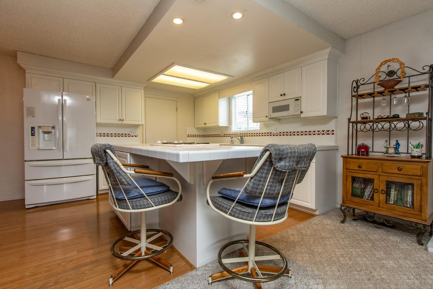 1540 Switzer Court Modesto, CA 95350 - Photo 9 of 43 a dining room with furniture and wooden floor