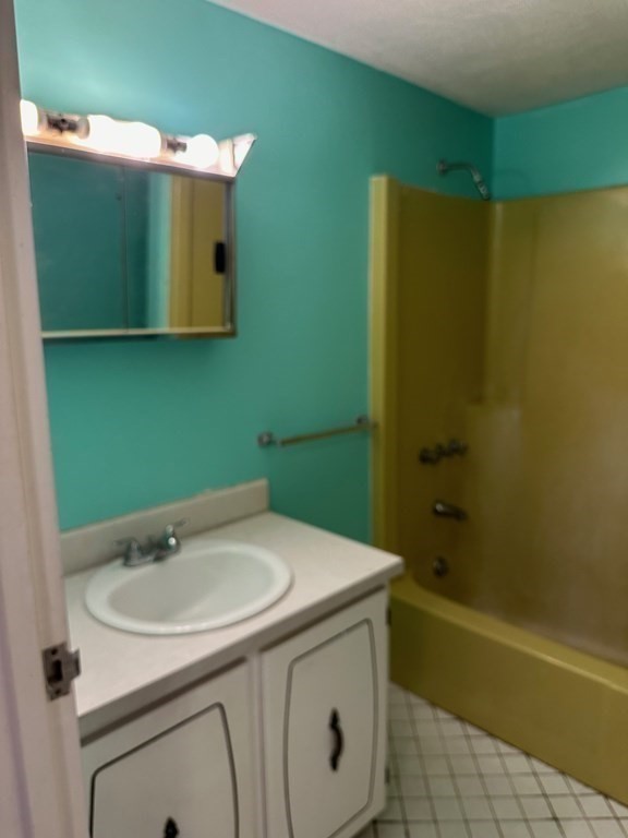 9 Broadway, Unit 223 Saugus, MA 01906 - Photo 11 of 23 a bathroom with a sink and a mirror