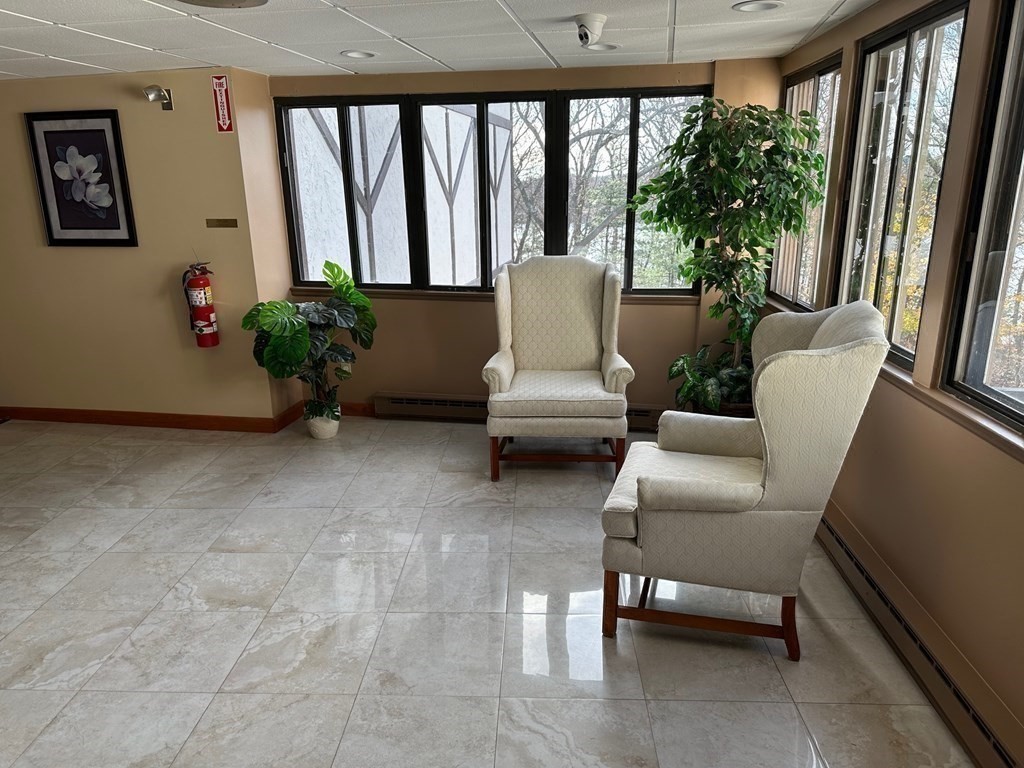9 Broadway, Unit 223 Saugus, MA 01906 - Photo 20 of 23 a living room with furniture and a potted plant