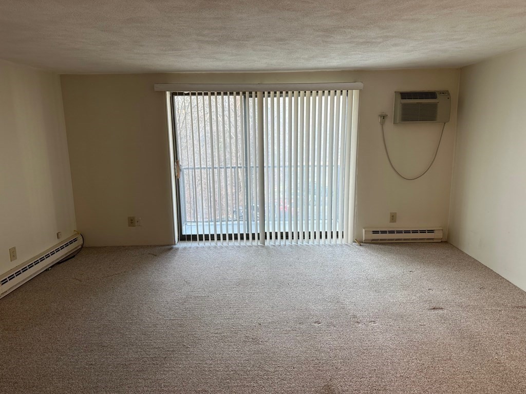 9 Broadway, Unit 223 Saugus, MA 01906 - Photo 2 of 23 an empty room with windows