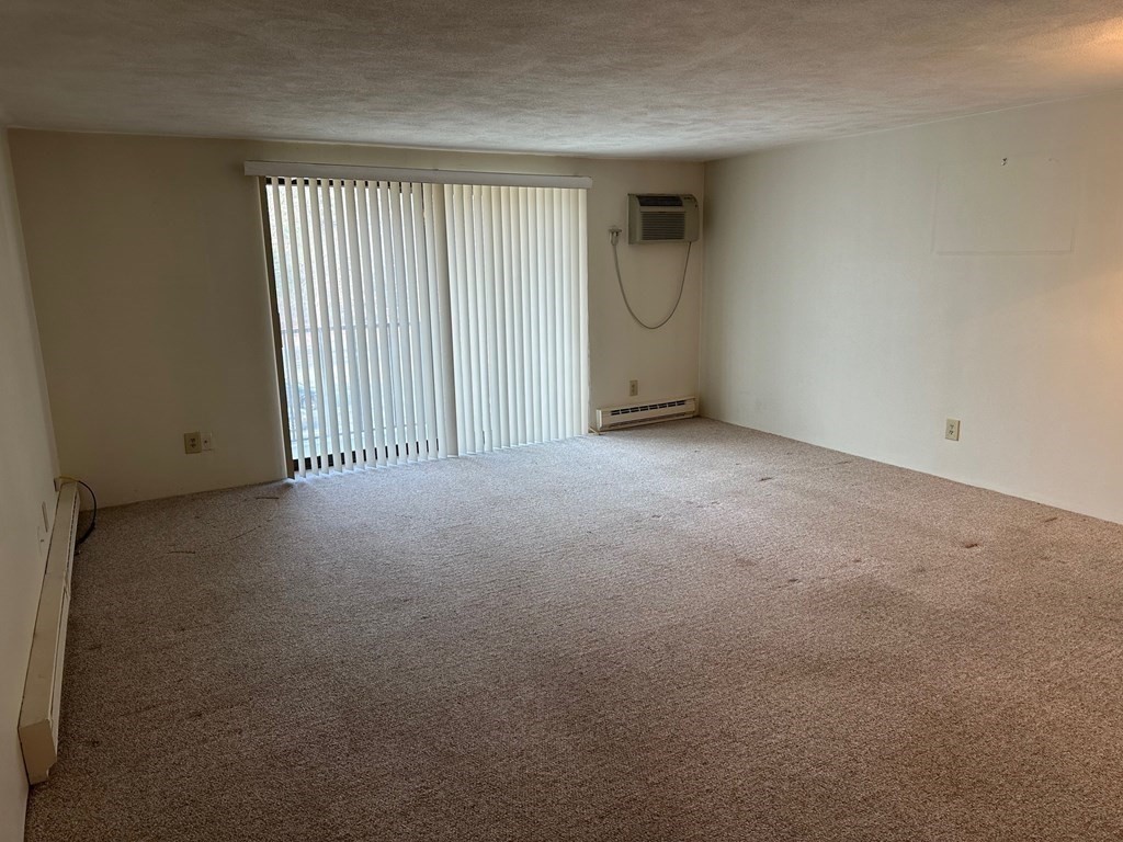 9 Broadway, Unit 223 Saugus, MA 01906 - Photo 3 of 23 an empty room with windows