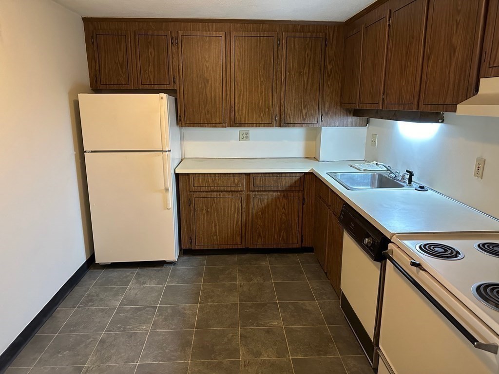 9 Broadway, Unit 223 Saugus, MA 01906 - Photo 9 of 23 a utility room with sink dryer and washer
