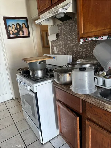 a kitchen with a stove and cabinets
