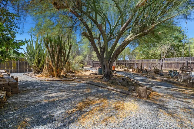 a view of a porch with wooden floor and outdoor space