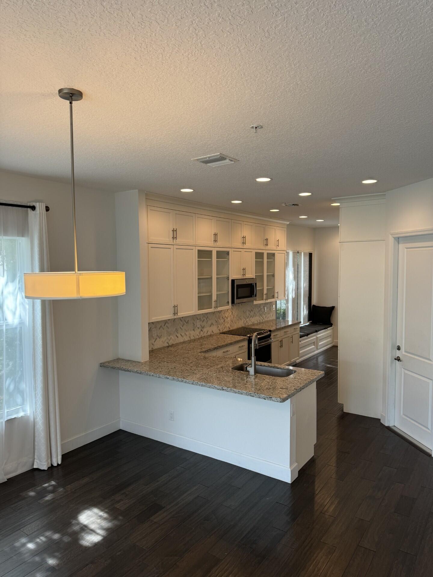 6640 Quiet Wave Trail, Unit 66 Boca Raton, FL 33433 - Photo 7 of 44 Kitchen - Island Bar