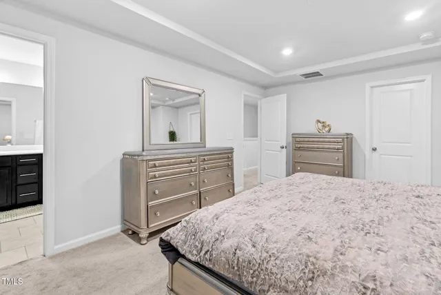 a view of a livingroom with furniture and staircase