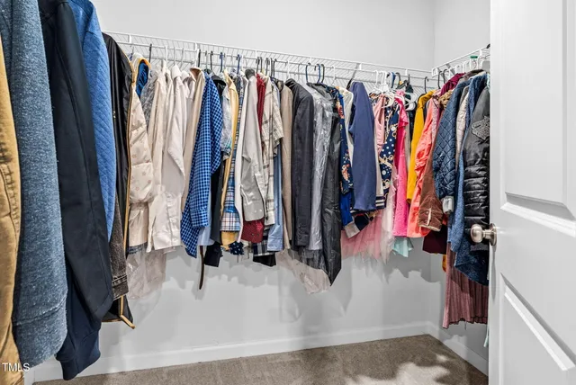 a bathroom with a double vanity sink toilet and shower