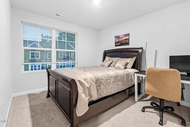 a view of walk in closet with clothes