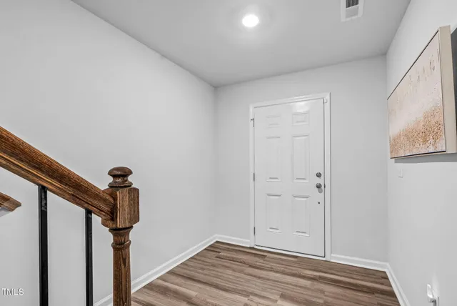 a view of a livingroom with workspace and a window