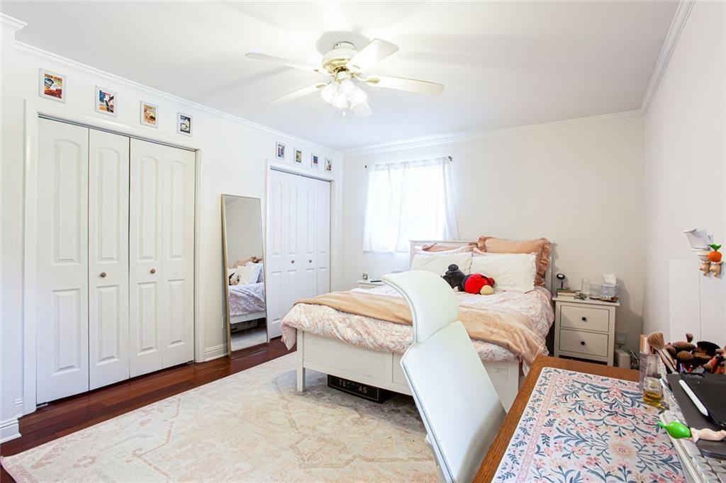2814 Goodfellows Road Tucker, GA 30084 - Photo 23 of 46 a bedroom with a bed and a chandelier