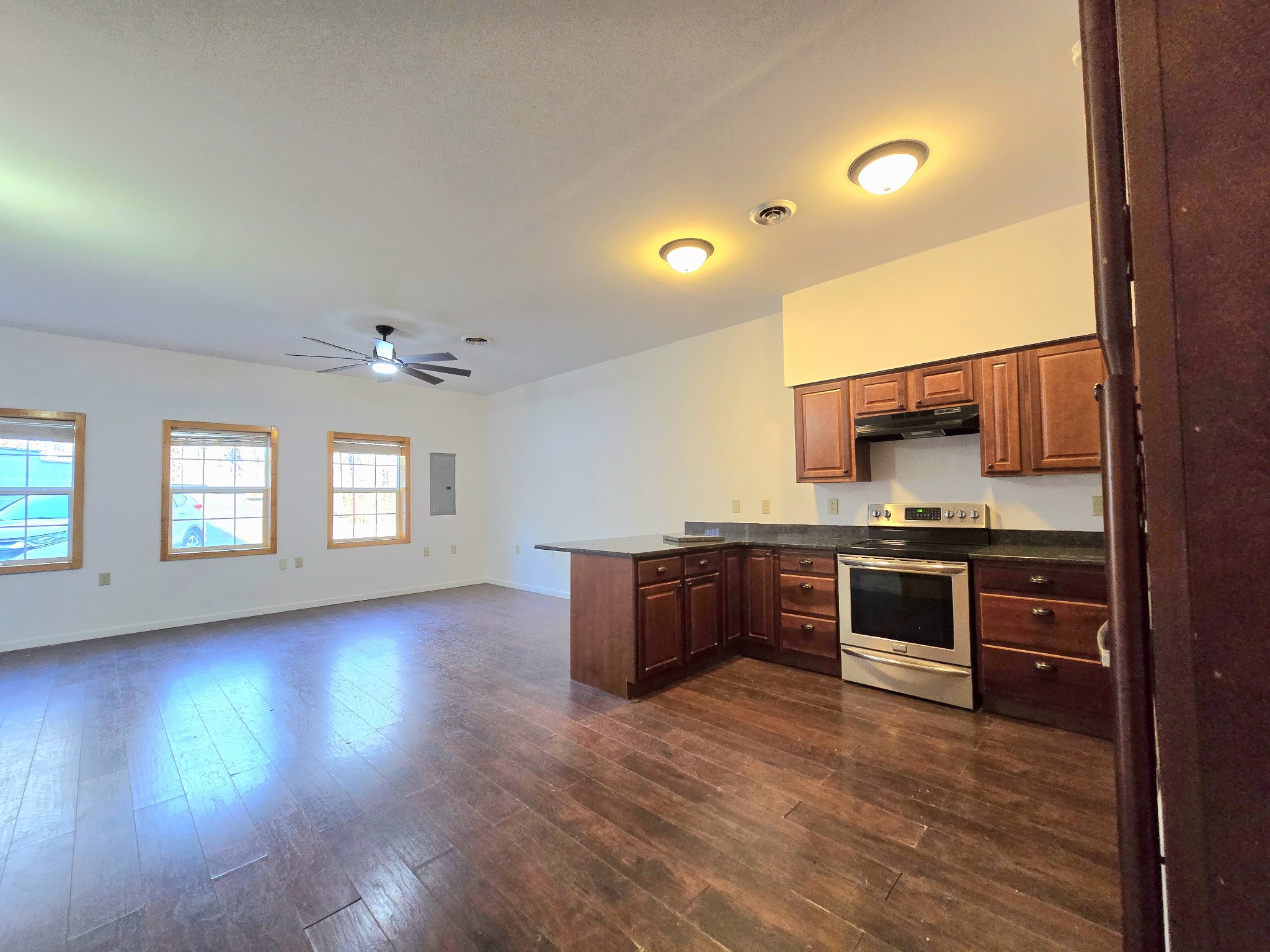 321 John Locke Road McMinnville, TN 37110 - Photo 12 of 57 a kitchen with stainless steel appliances granite countertop a stove cabinets and wooden floor