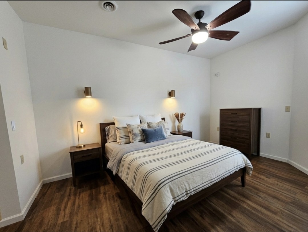 321 John Locke Road McMinnville, TN 37110 - Photo 15 of 57 a bedroom with a bed and a lamp