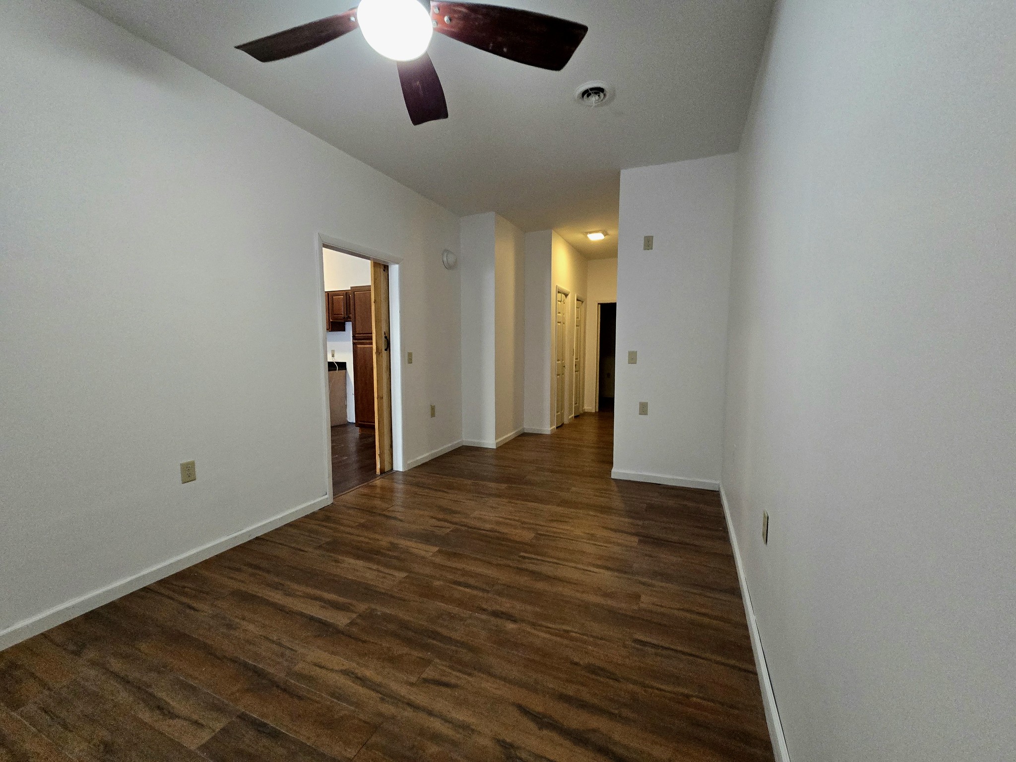 321 John Locke Road McMinnville, TN 37110 - Photo 16 of 57 an empty room with wooden floor a ceiling fan and closet