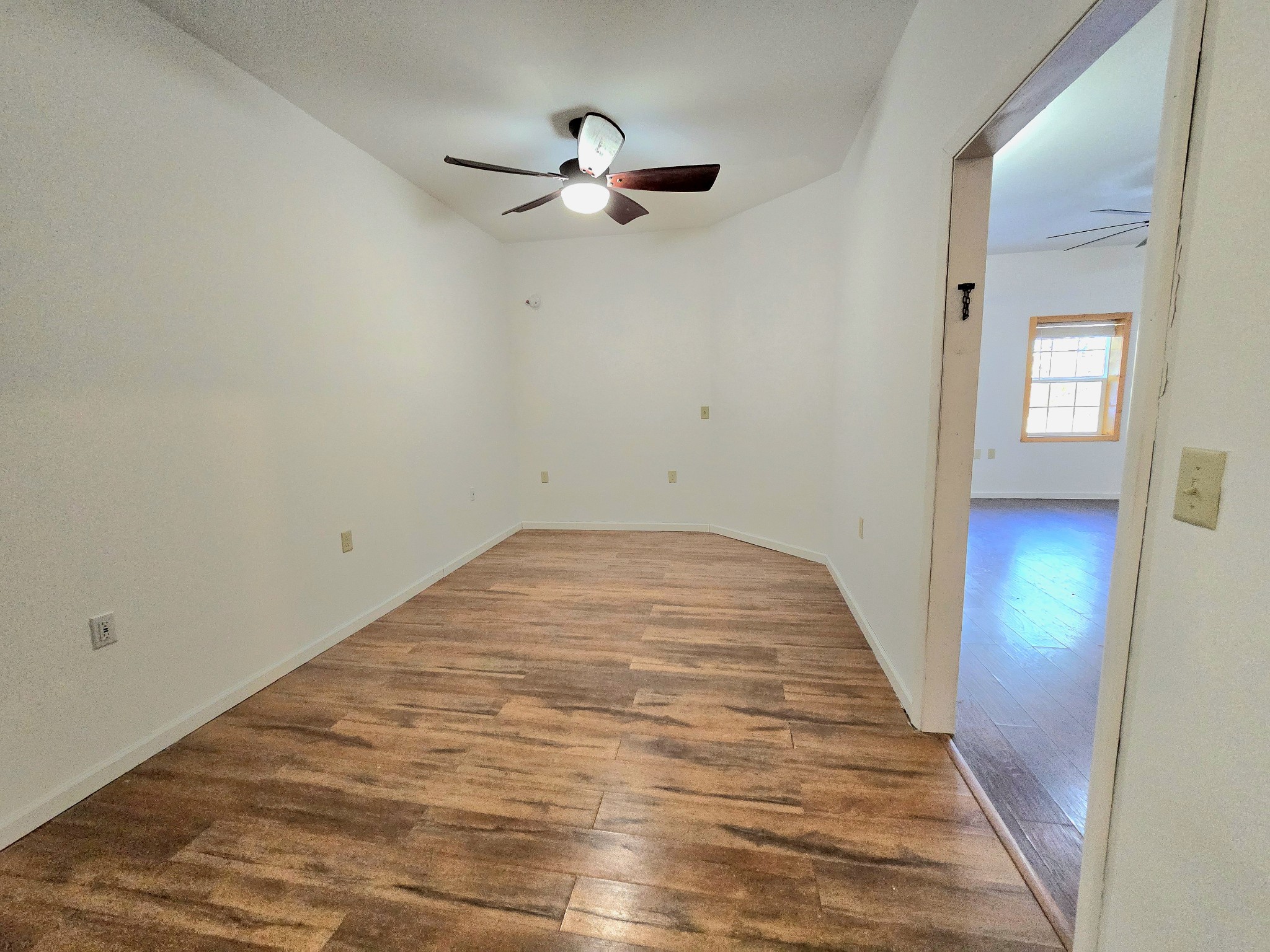 321 John Locke Road McMinnville, TN 37110 - Photo 27 of 57 a view of a room with wooden floor and ceiling fan