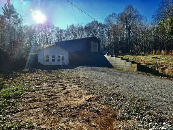 a view of a backyard of the house