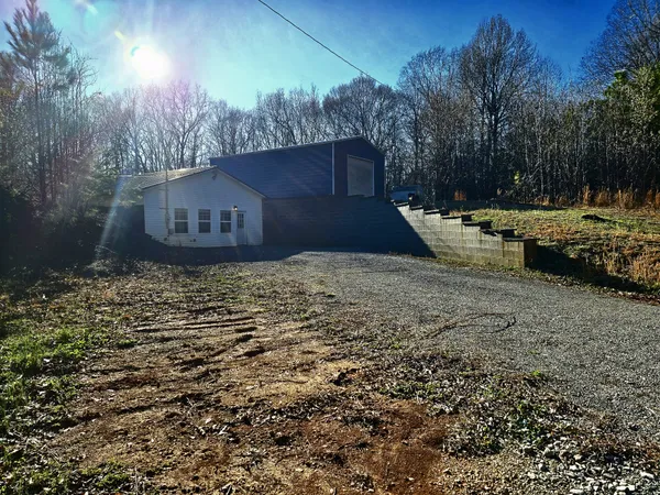 a view of a backyard of the house