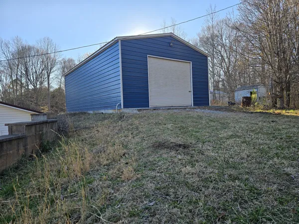 a view of a backyard of the house