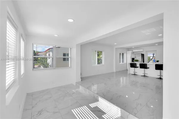 a view of livingroom with furniture and windows
