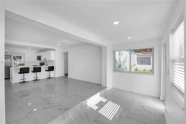 a view of livingroom with furniture and windows