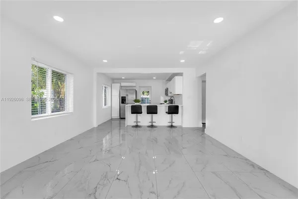 a view of livingroom with furniture and window
