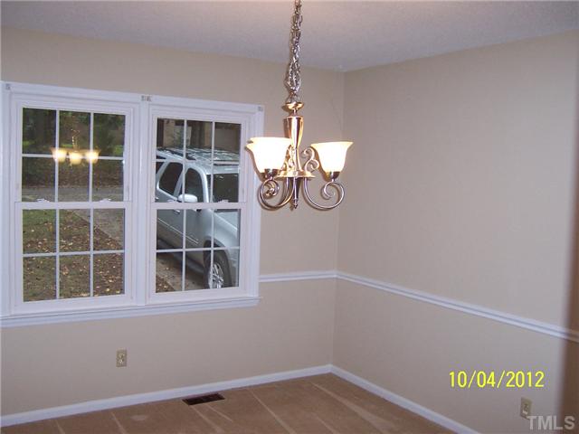 1908 Medfield Road Raleigh, NC 27607 - Photo 5 of 9 a view of empty room with windows and pendant light
