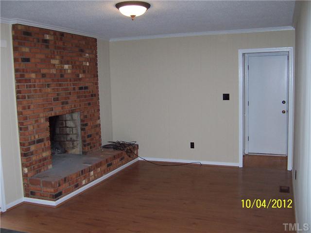 1908 Medfield Road Raleigh, NC 27607 - Photo 8 of 9 a room with a fireplace
