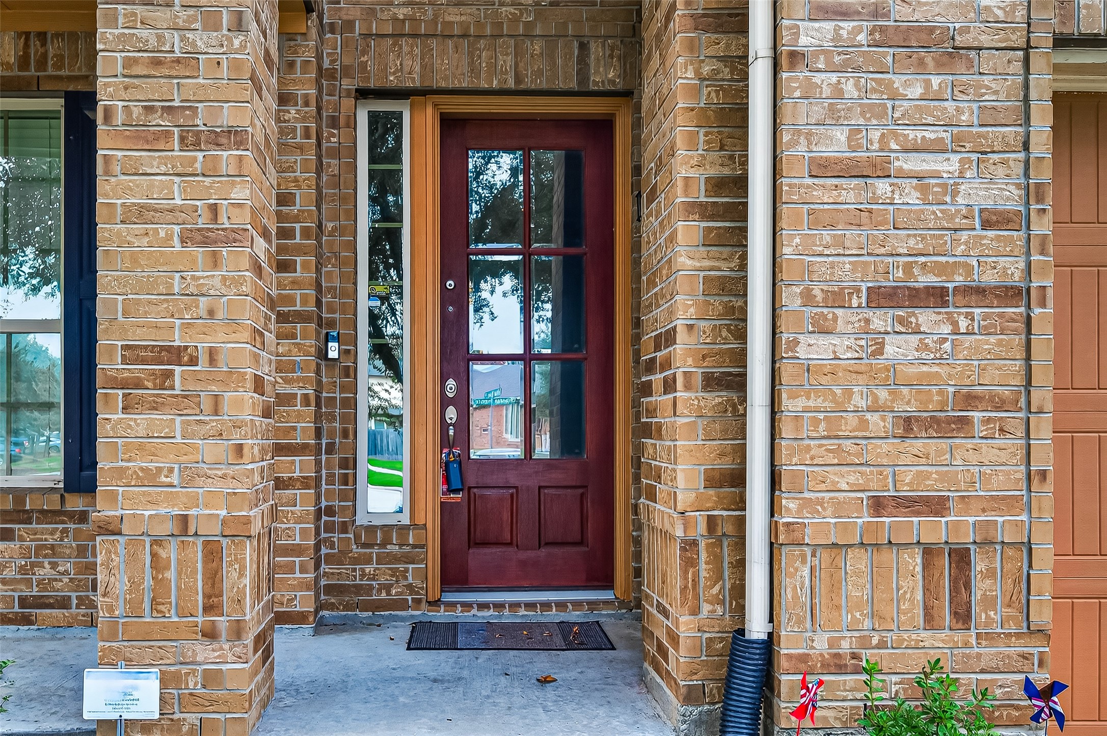 8107 Lockridge Terrace Lane Cypress, TX 77433 - Photo 6 of 50 Imagine coming home to this. This charming entryway immediately wraps you in a feeling of comfort and belonging. The classic, all-brick facade provides a sense of security, while the beautiful, light-letting front door and sidelight cast a warm, inviting glow. It’s the perfect, heartfelt introduction to the love and memories waiting for you just inside.