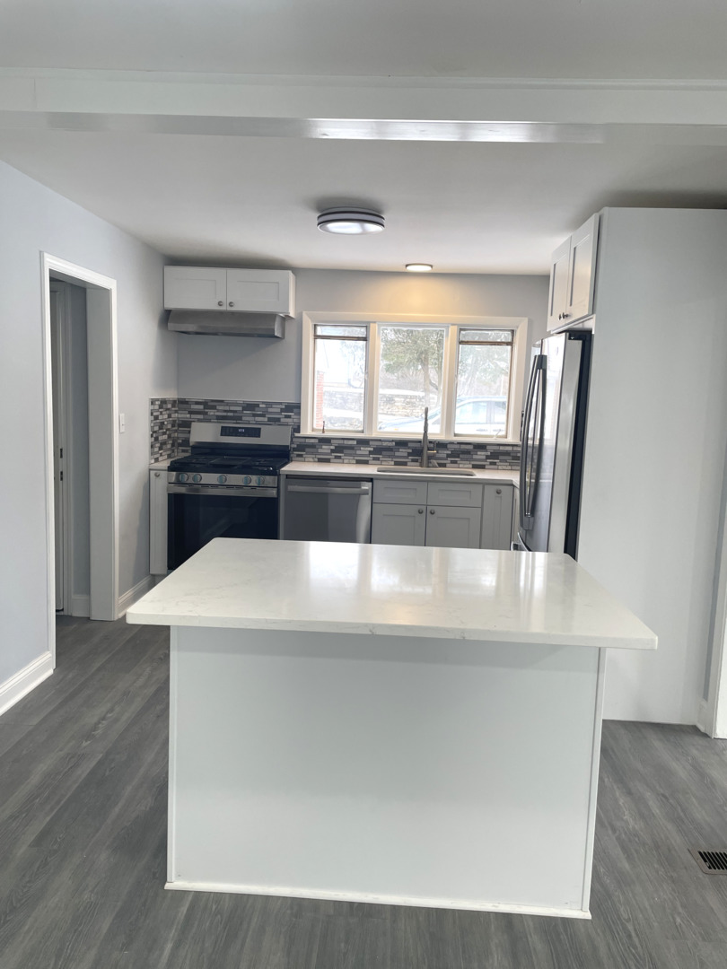 205 Fairview Boulevard Rockford, IL 61107 - Photo 10 of 12 a kitchen with stainless steel appliances a refrigerator a sink a stove a microwave a counter top and oven