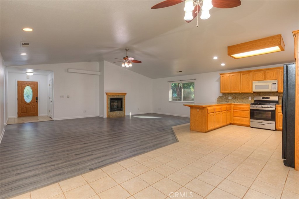 14503 Colter Way Magalia, CA 95954 - Photo 11 of 42 a view of a kitchen with microwave and cabinets