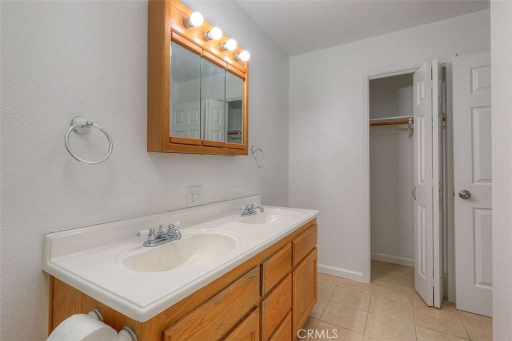 14503 Colter Way Magalia, CA 95954 - Photo 27 of 42 a bathroom with a sink and a mirror