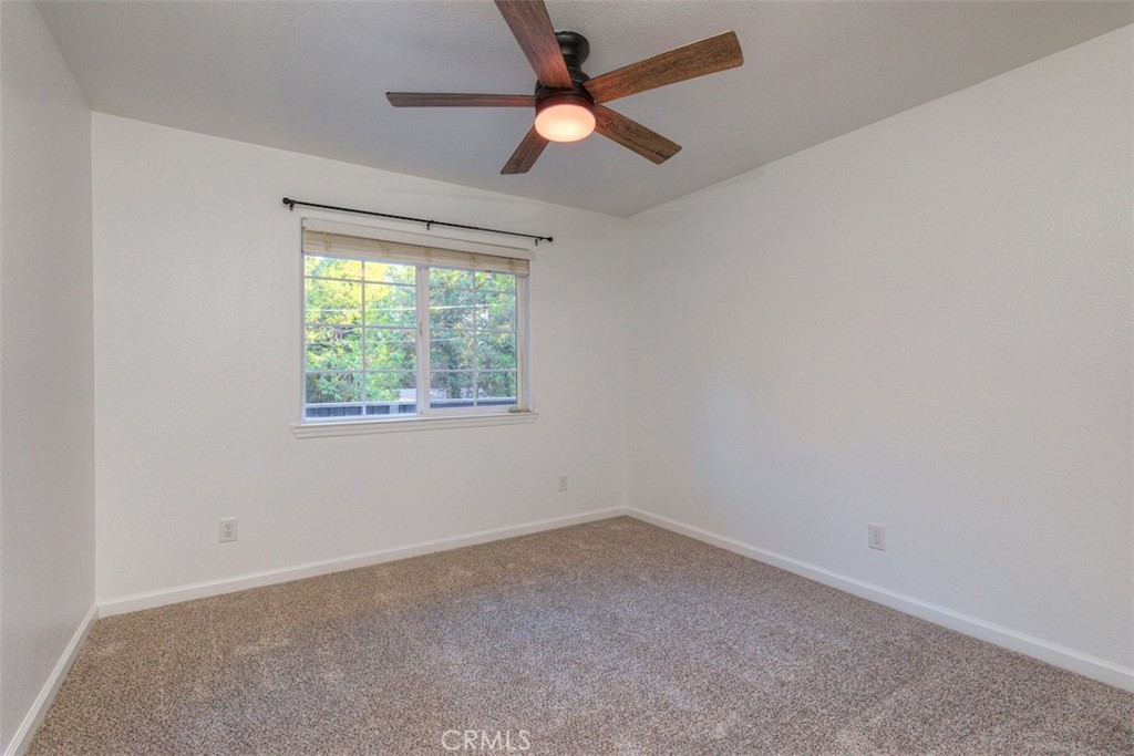 14503 Colter Way Magalia, CA 95954 - Photo 30 of 42 an empty room with a window and a fan