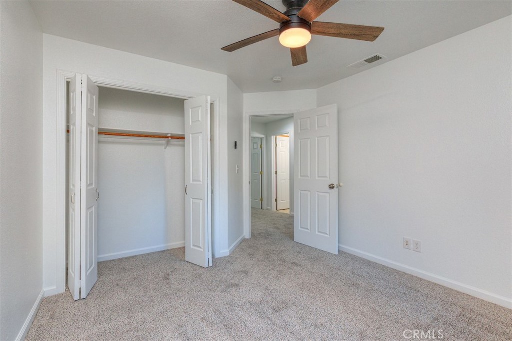 14503 Colter Way Magalia, CA 95954 - Photo 31 of 42 an empty room and chandelier fan