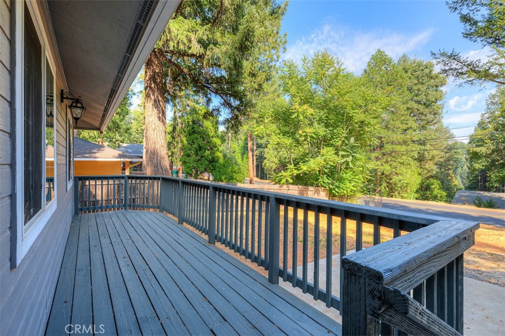 14503 Colter Way Magalia, CA 95954 - Photo 34 of 42 a balcony with wooden floor and outdoor seating