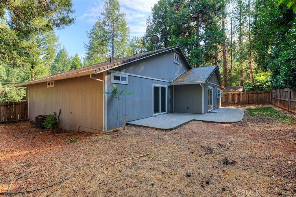 14503 Colter Way Magalia, CA 95954 - Photo 40 of 42 a view of a house with a yard and garage
