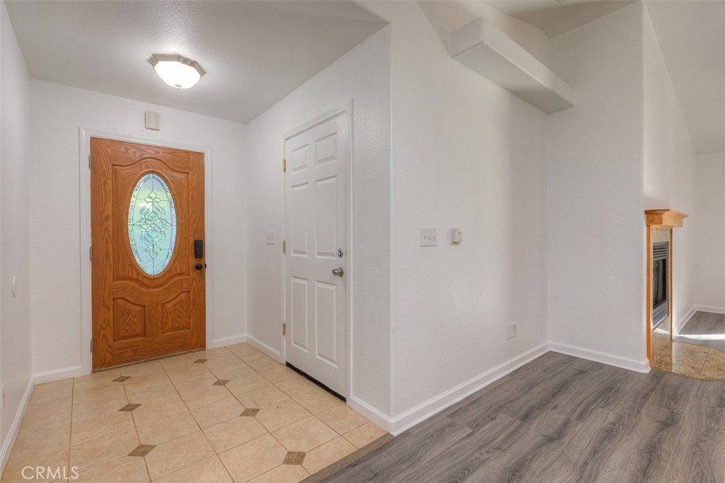 14503 Colter Way Magalia, CA 95954 - Photo 5 of 42 an empty room with wooden floor mirror and windows