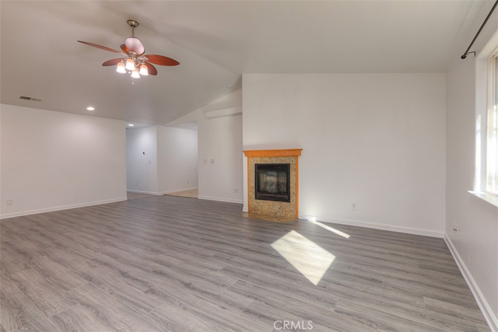 14503 Colter Way Magalia, CA 95954 - Photo 8 of 42 a view of an empty room with wooden floor and a window