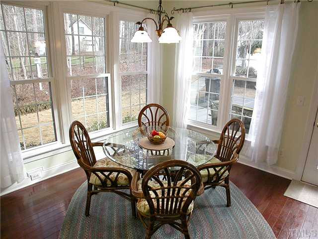 6812 Cool Pond Road Raleigh, NC 27613 - Photo 9 of 25 Imagine Enjoying Your Morning Coffee in This Breakfast Room Surrounded by Windows Overlooking the Amazing Back Yard Kitchen