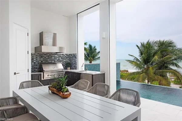 a view of living room with furniture and a fireplace