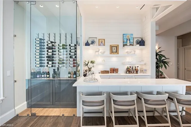 a dining room with furniture and wooden floor