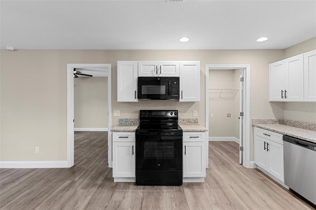 603 Moose Lodge Road, Unit A Bartow, FL 33830 - Photo 29 of 45 a kitchen with a stove and a refrigerator