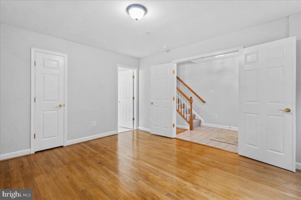 3618 Sprigg Street South Frederick, MD 21704 - Photo 11 of 37 a view of an empty room with wooden floor and entryway