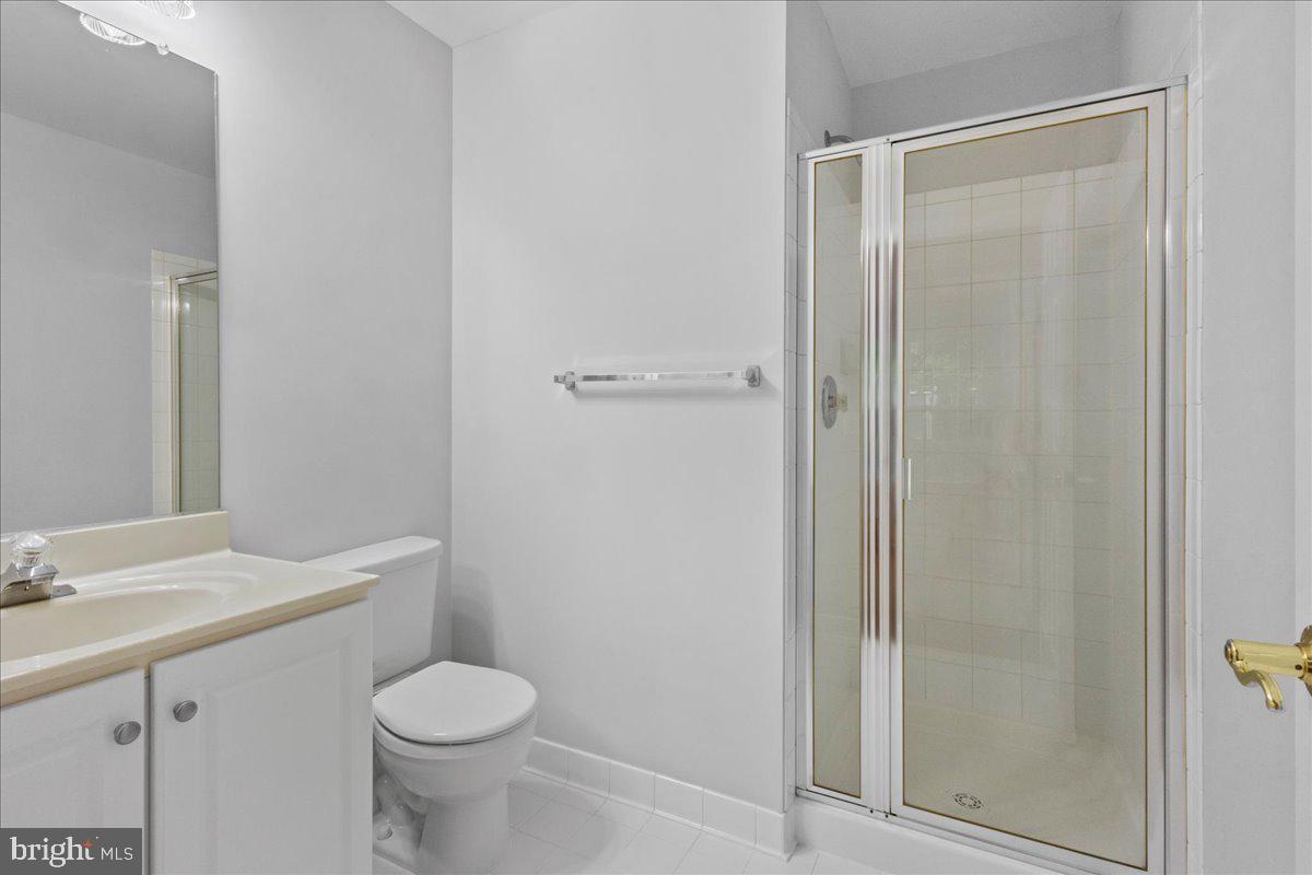 3618 Sprigg Street South Frederick, MD 21704 - Photo 13 of 37 a bathroom with a granite countertop sink toilet and shower