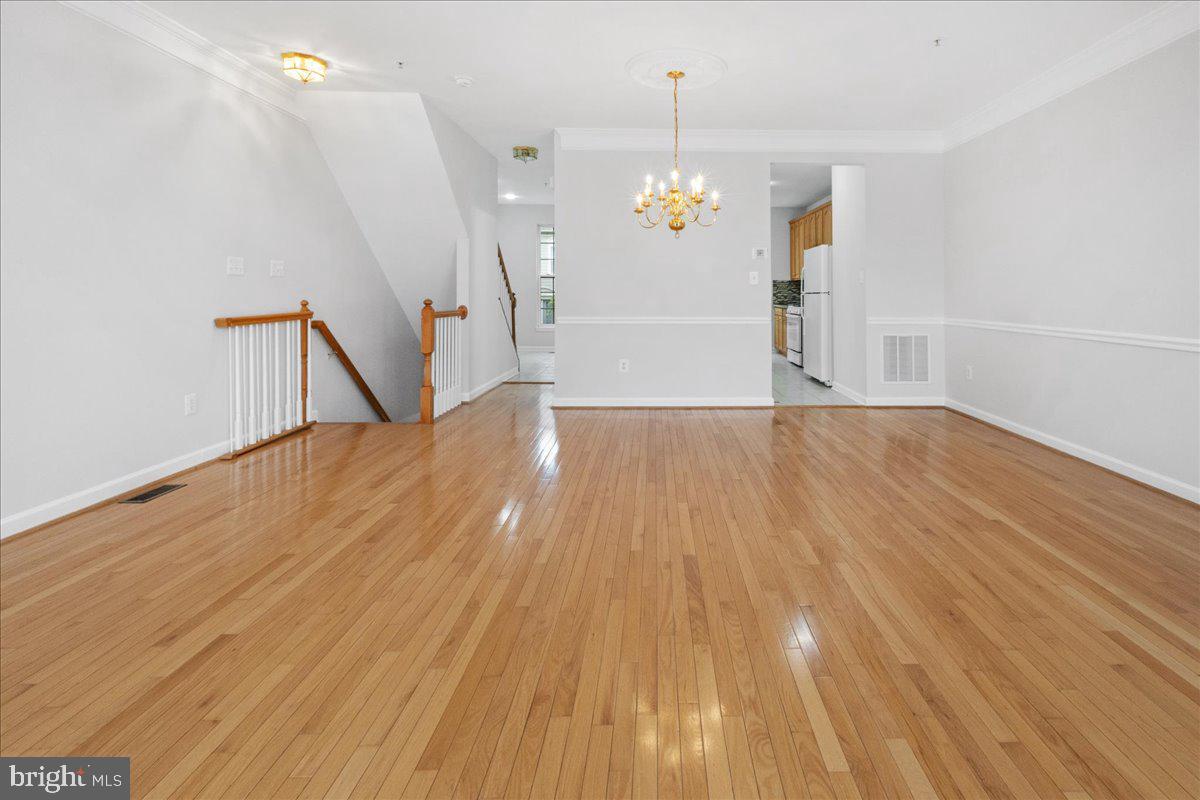 3618 Sprigg Street South Frederick, MD 21704 - Photo 23 of 37 a view of empty room with wooden floor and window