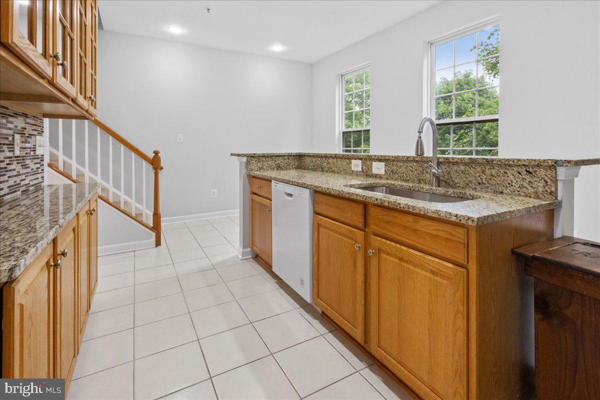 3618 Sprigg Street South Frederick, MD 21704 - Photo 26 of 37 a bathroom with a granite countertop sink and a mirror