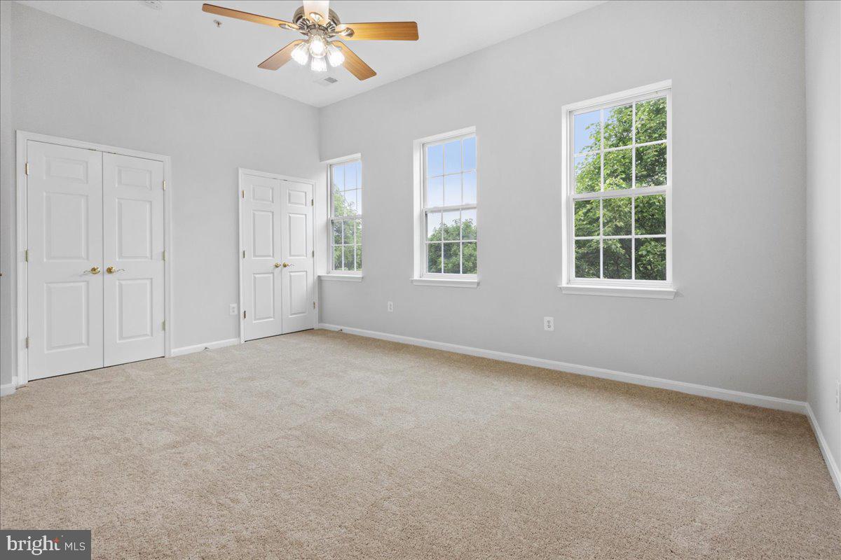 3618 Sprigg Street South Frederick, MD 21704 - Photo 31 of 37 an empty room with a window and a ceiling fan